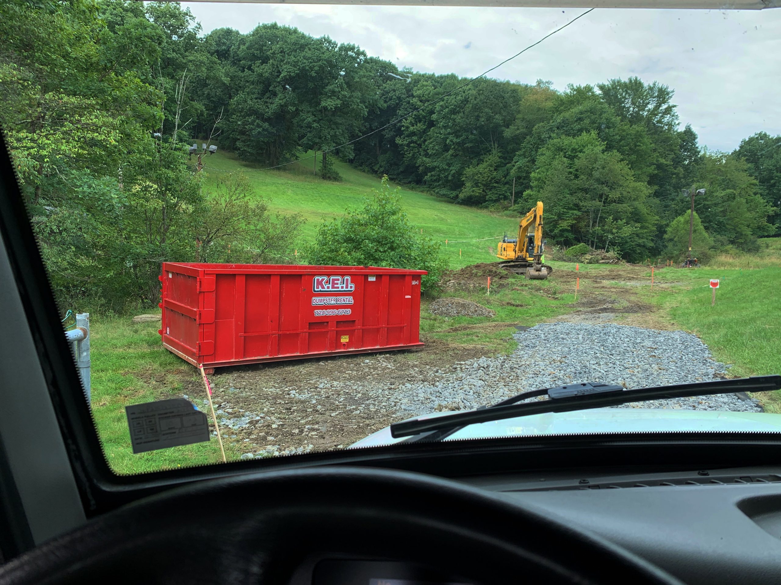 A KEI dumpster is delivered to a remote location in Slippery Rock Borough that needed local dumpsters for a construction project.