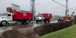 KEI trucks deliver a commercial dumpster rental to clients in Butler.